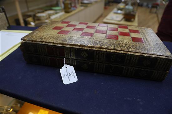 A Backgammon / chess board with stained ivory pieces